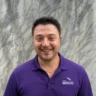 Jonathan Hargadon owner of Morris County Roofing and Siding wearing a purple MOCO polo shirt